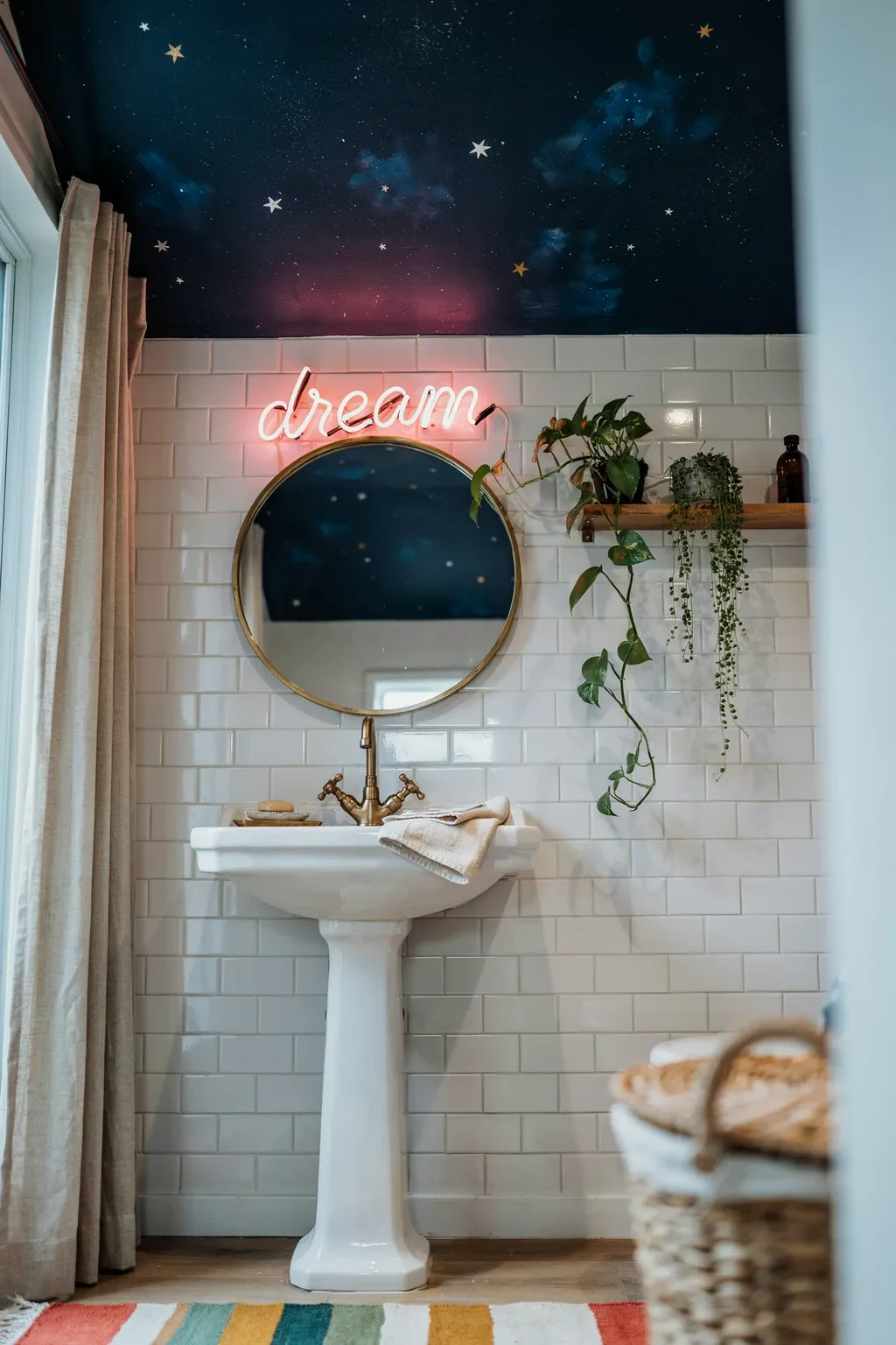Funky bathroom with a pink neon dream sign under a painted starry ceiling