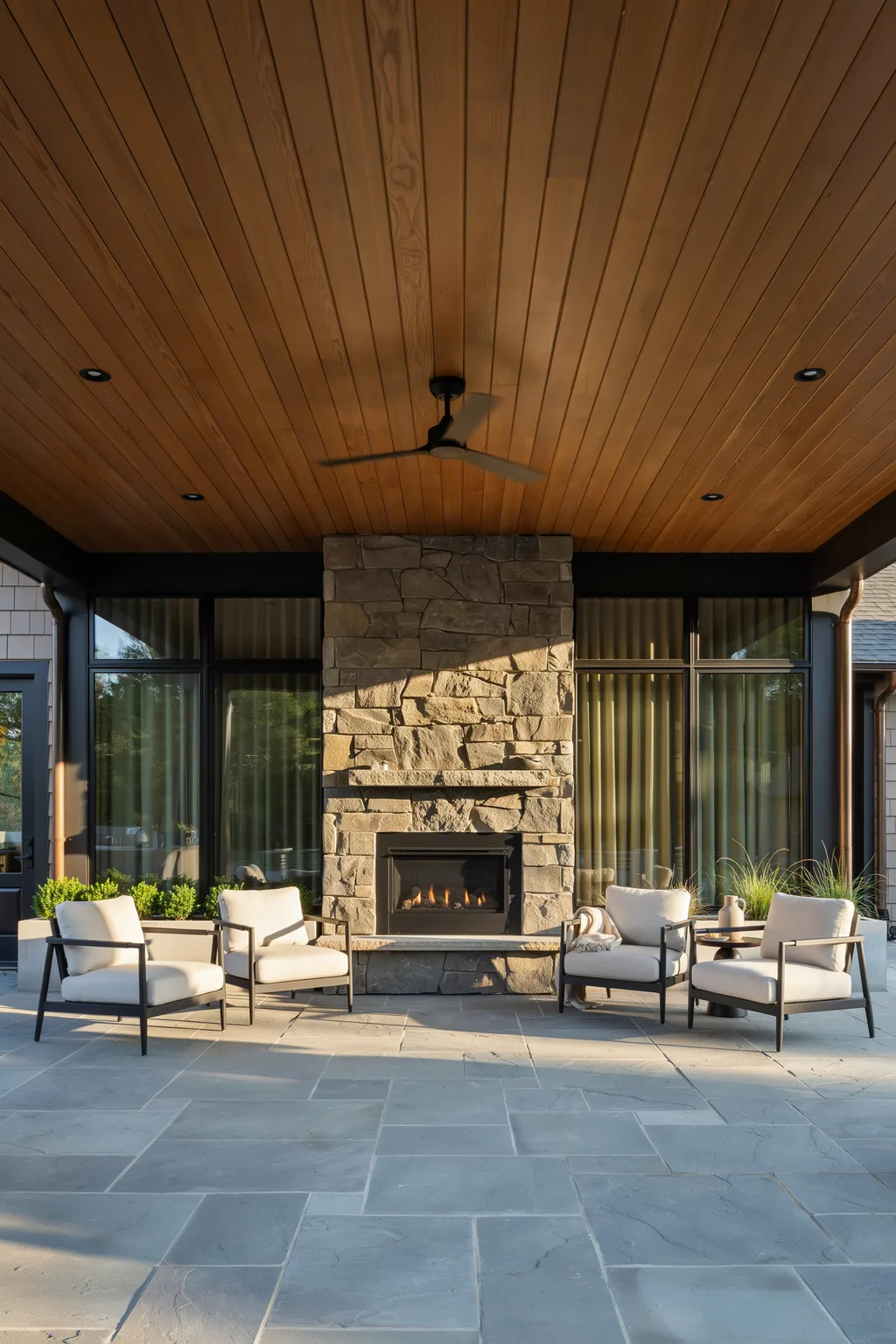 Four Chairs Around a Modern Stone Fireplace