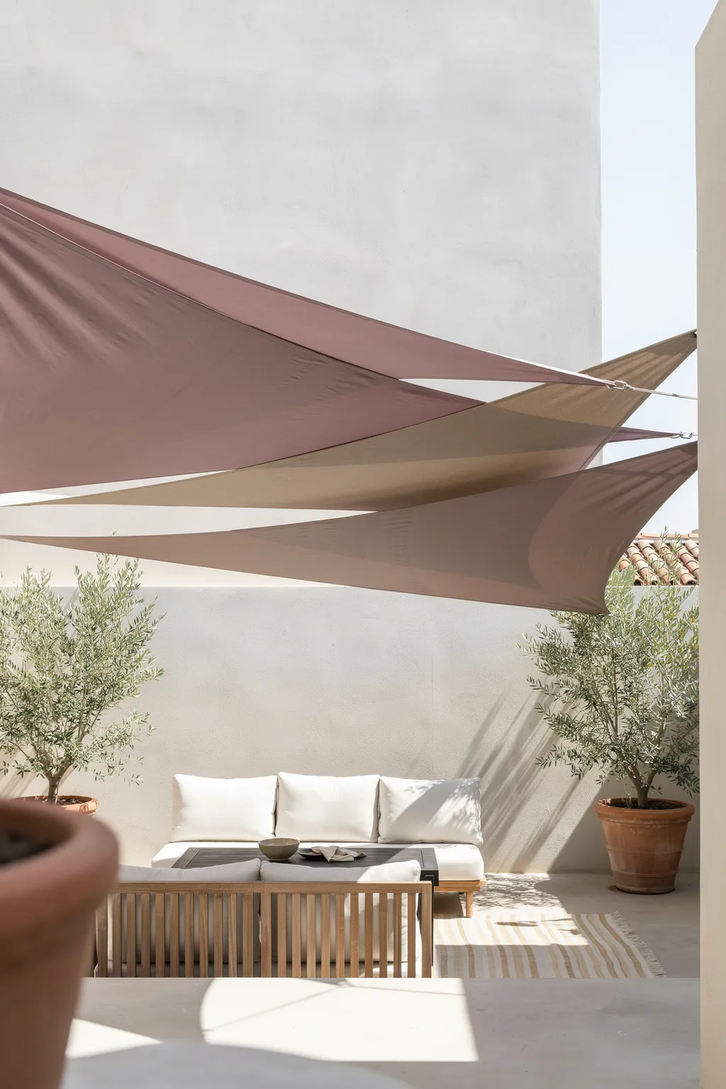 Overlapping Shade Sails Over a Modern Patio