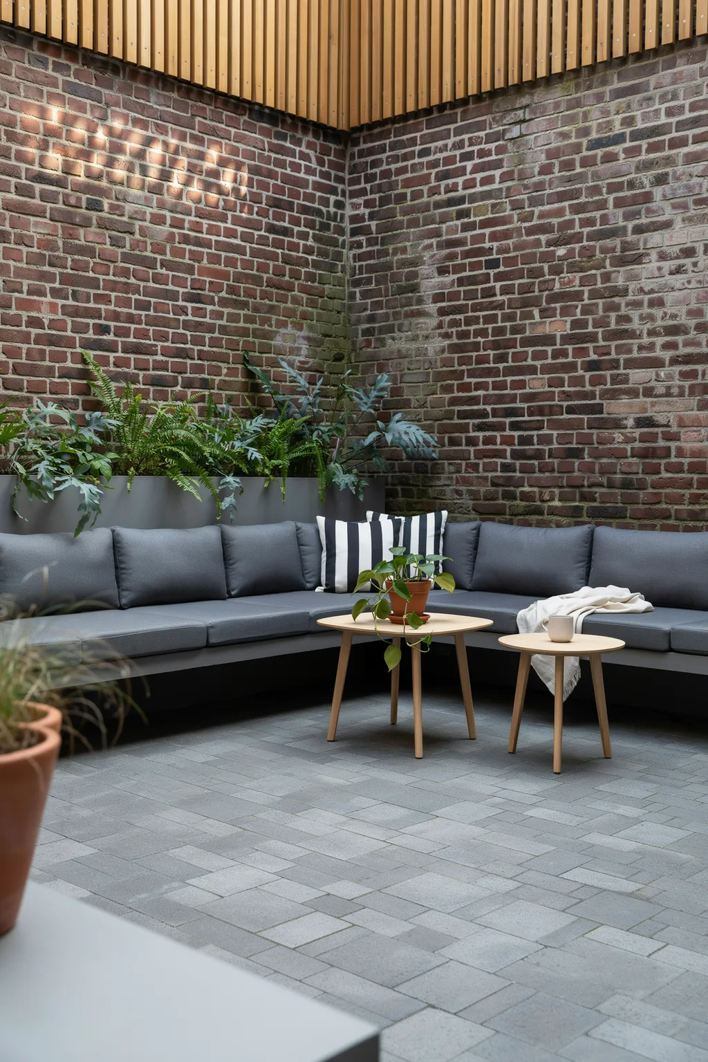 Corner Sectional For A Tiny Courtyard