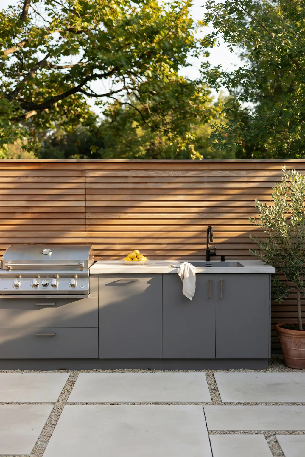 Outdoor Kitchen With Slatted Privacy Wall