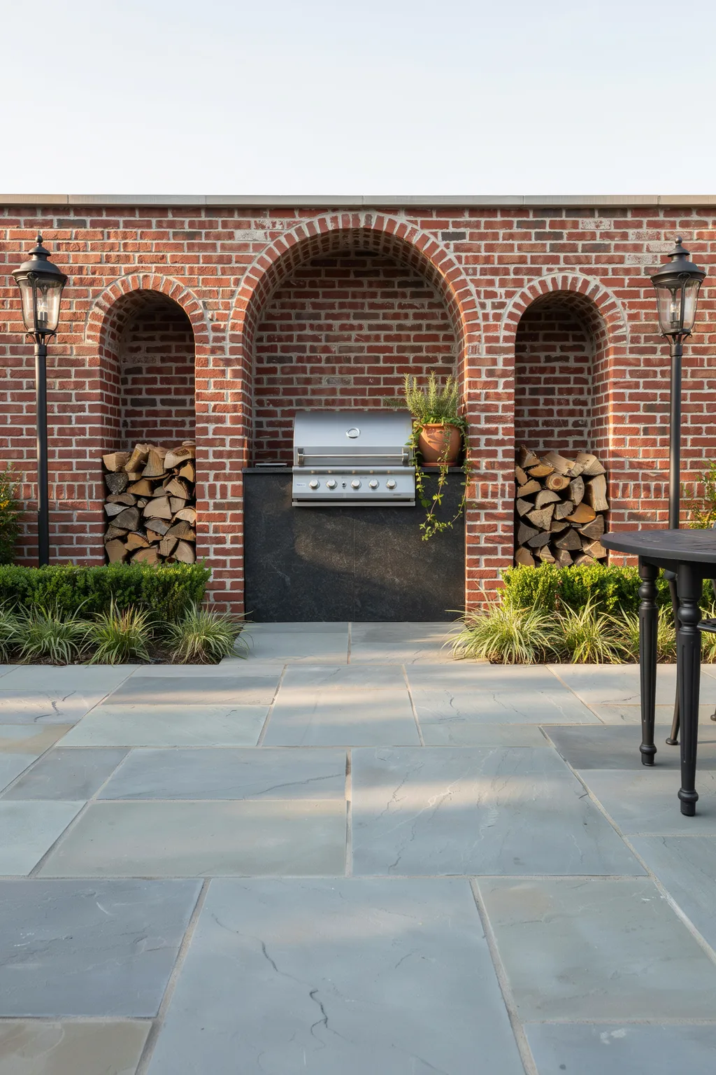 Brick Archway Outdoor Kitchen With Lanterns