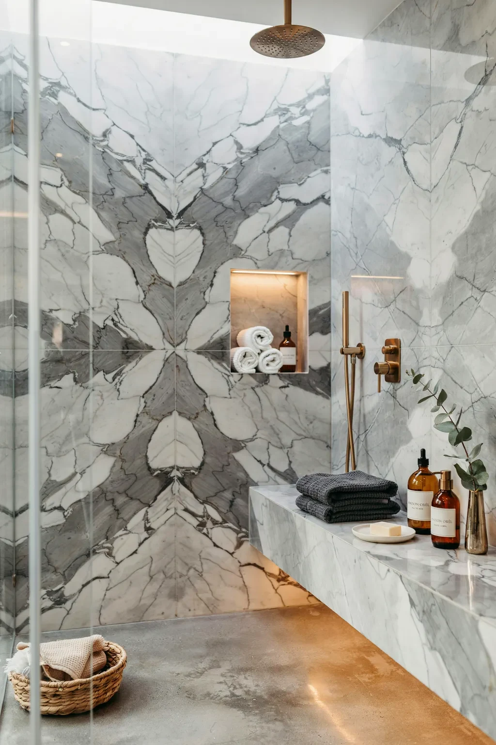 Spa shower with large-format book-matched grey marble tile walls